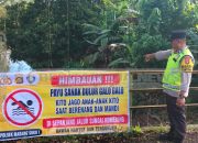Polsek Madang Suku I Pasang Spanduk Larangan Berenang di Sungai untuk Cegah Kecelakaan