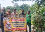 Polsek Madang Suku I Pasang Spanduk Larangan Berenang di Sungai Komering