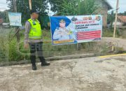Pemasangan Spanduk Himbauan Curanmor, Polsek Madang Suku I Ajak Warga Lebih Waspada