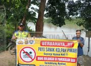 Polsek Madang Suku I Pasang Spanduk Larangan Bermain dan Berenang di Sungai Komering