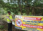 Bhabinkamtibmas Sosialisasikan Larangan Mandi dan Berenang di Sungai di Desa Mangulak