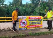 Bhabinkamtibmas Polsek Madang Suku I Sosialisasikan Larangan Berenang di Sungai kepada Warga Rasuan