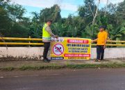 Cegah Bahaya Tenggelam, Bhabinkamtibmas Polsek Madang Suku I Sosialisasikan Larangan Mandi di Sungai