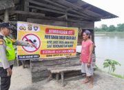 Curah Hujan Tinggi, Aiptu Zulkarnaen Imbau Warga Tidak Mandi dan Berenang di Sungai