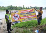 Bripka Bobi Juanda Sosialisasikan Larangan Mandi dan Berenang di Sungai, Wujudkan Keselamatan Warga