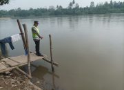Polsek Madang Suku I Pantau Kondisi Sungai Komering, Debit Air Terpantau Aman dan Warga Tetap Beraktivitas