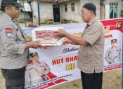 Sambut Hari Bhayangkara ke-80, Polsek Madang Suku I Salurkan Bantuan Sosial untuk Warga Membutuhkan