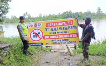 Polsek Madang Suku I Sosialisasikan Larangan Mandi di Sungai Komering, Imbau Warga Waspadai Bahaya